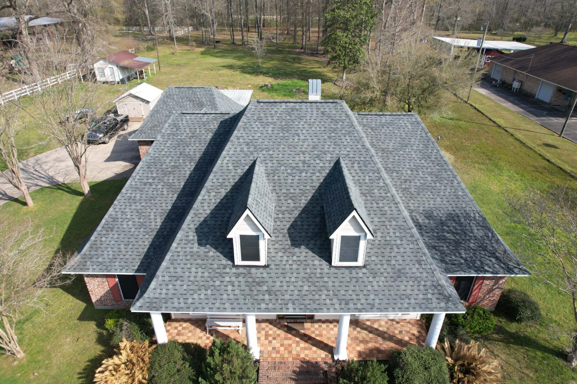 Aerial view of a dark shingle roof on a Baton Rouge home