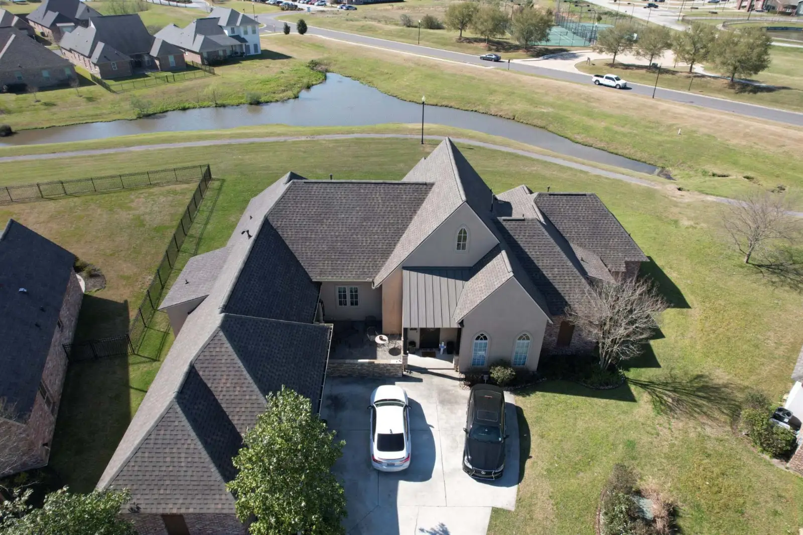 Aerial view of a new roof on a lakeside Baton Rouge home